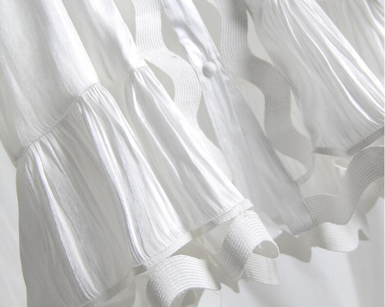 Korean version of the temperament solid color hollow wavy striped stand collar long-sleeved shirt fishtail dress