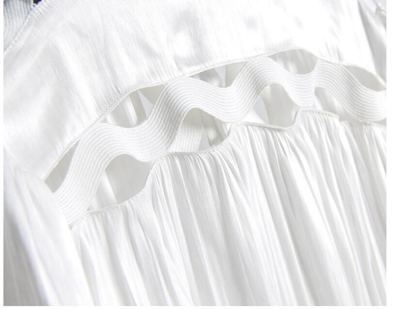 Korean version of the temperament solid color hollow wavy striped stand collar long-sleeved shirt fishtail dress